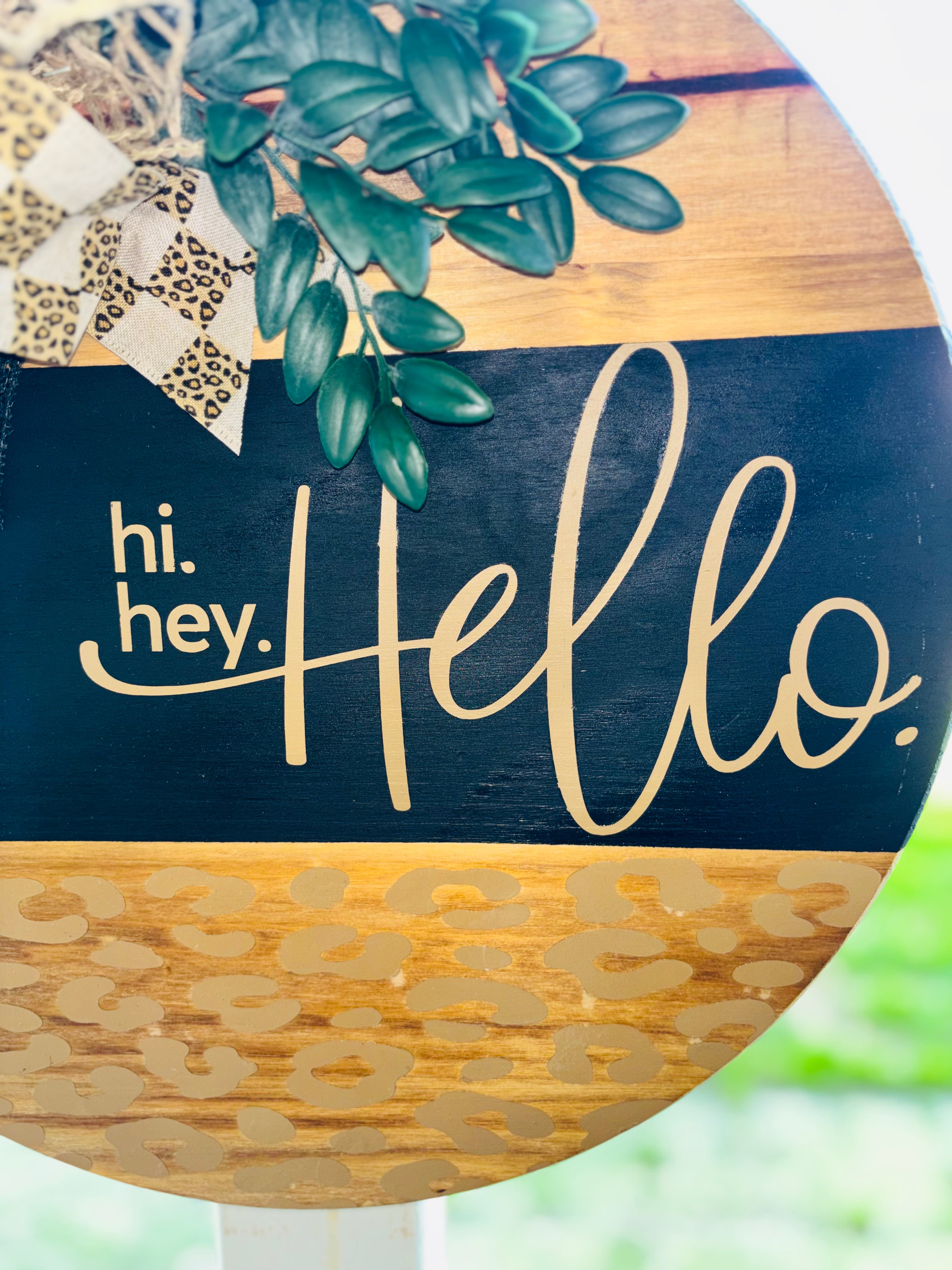 Hi, hey, hello leopard print door hanger